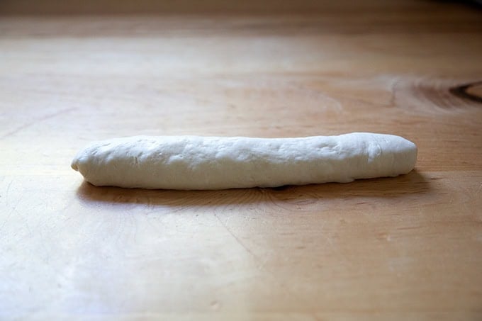 A shaped unbaked baguette ready to be proofed.