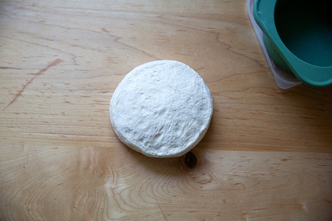 A round of baguette dough removed from its storage vessel.