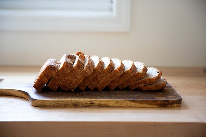 Sliced rye bread on a board.