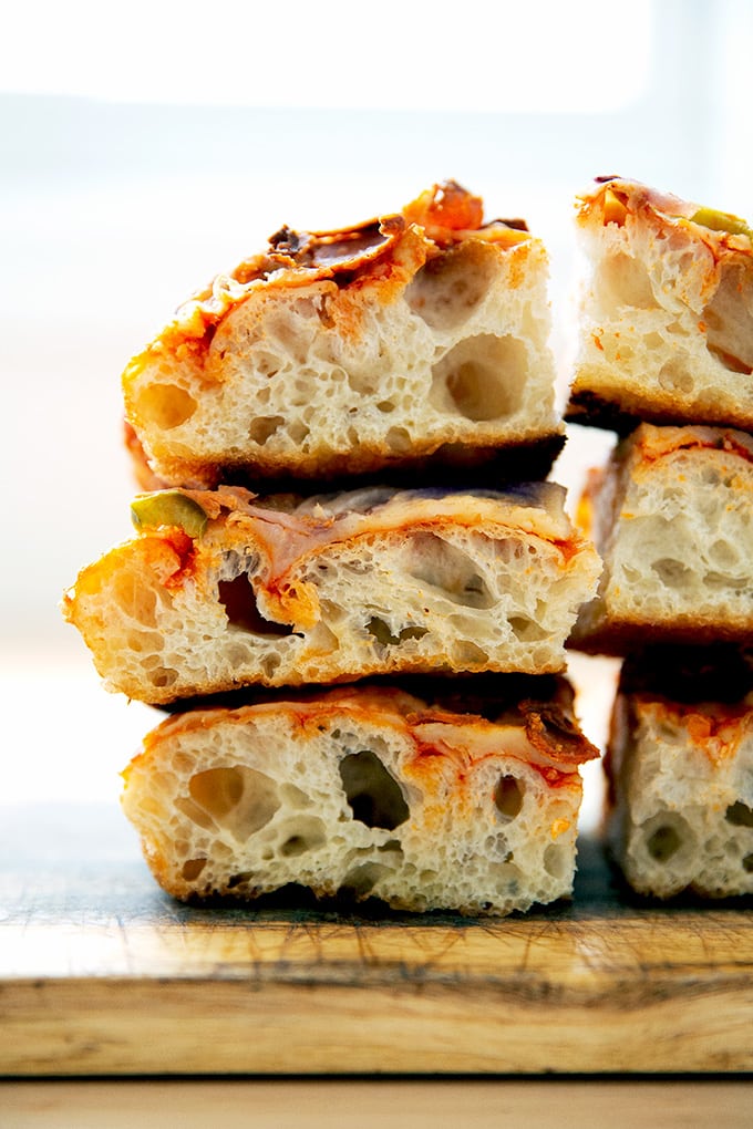 A stack of Sicilian-style pizza squares.