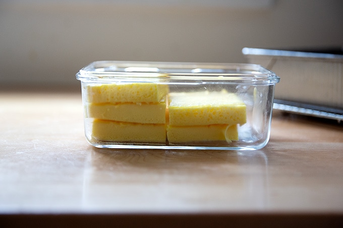 Egg slices in a glass storage container.