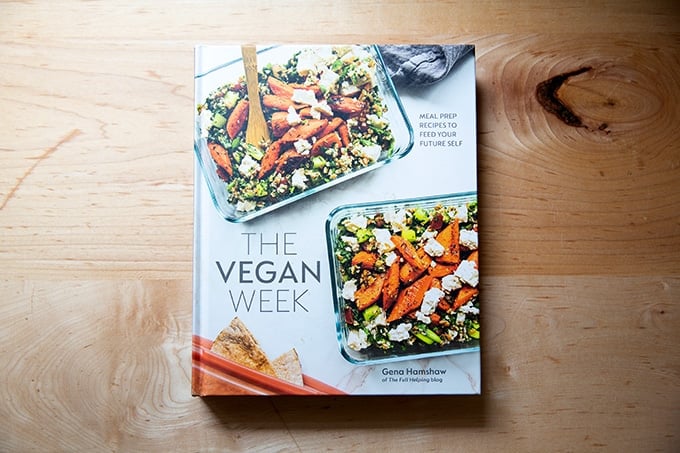The Vegan Week, a cookbook, sitting on a countertop.