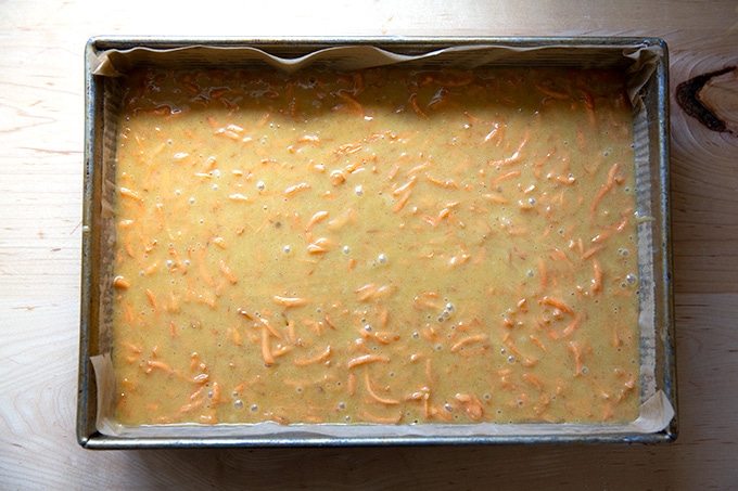 A 9x13-inch pan filled with carrot cake batter.