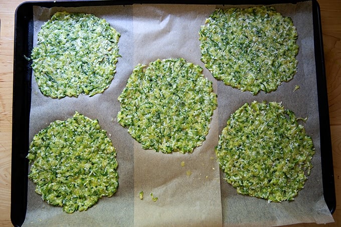 Unbaked zucchini tacos on a sheet pan.