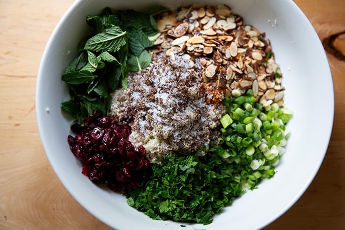 Ingredients to make cauliflower couscous salad in a bowl.