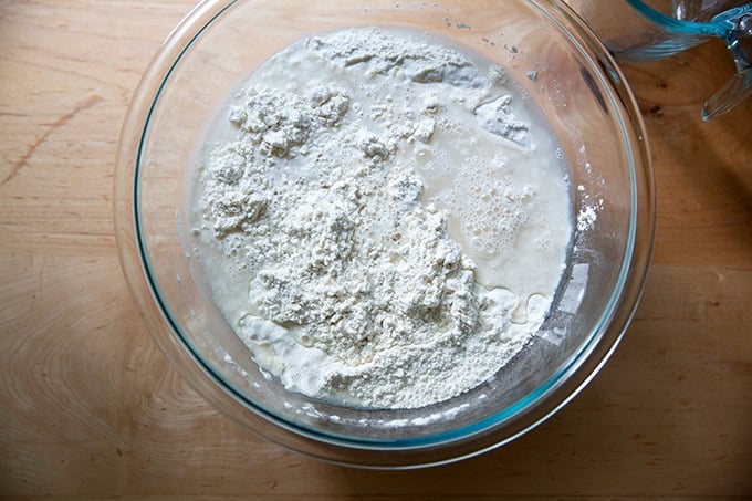 A bowl of unmixed baguette dough.