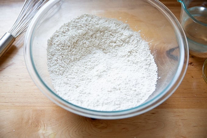 The dry ingredients to make gluten-free pizza crust whisked together in a large bowl.