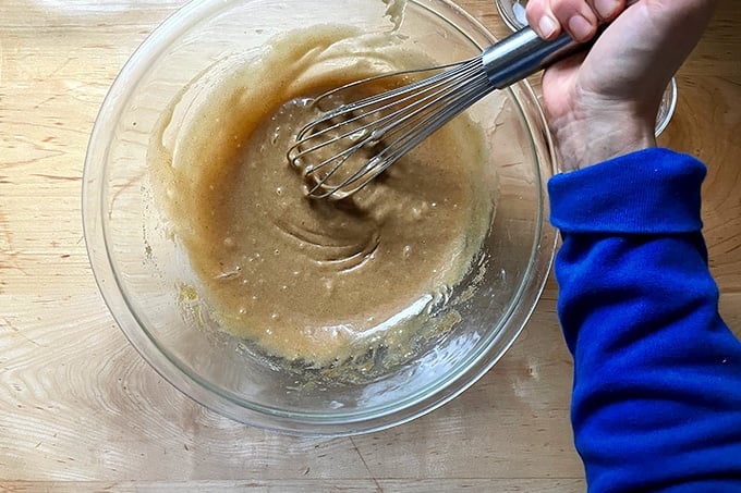 Whisking together the white chocolate and macadamia nut cookie dough.