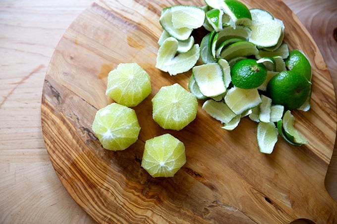 Peeled limes on a board. 