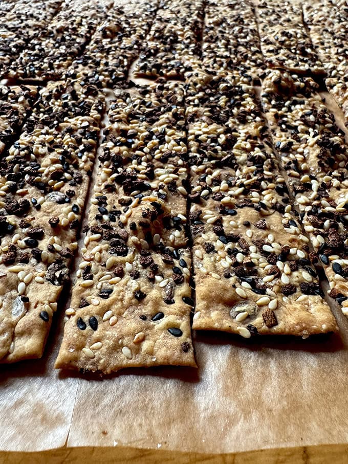 An up-close shot of the edge of just-baked sourdough discard crackers.  - 124