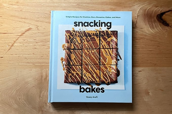 Snacking Bakes, a cookbook, on a countertop. 