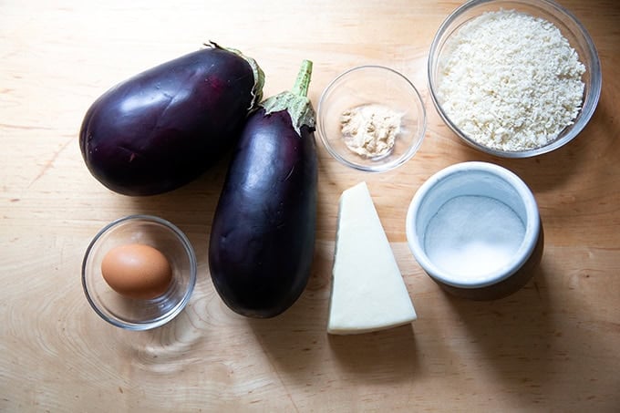The ingredients to make eggplant meatballs on a countertop. - 2