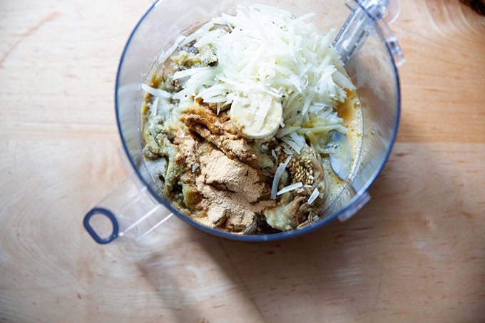 The ingredients to make eggplant meatballs in a food processor. - 6