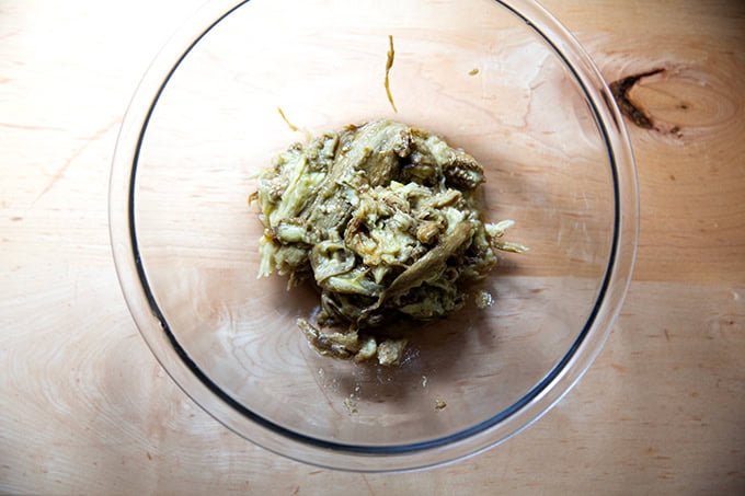 Roasted eggplant flesh in a large bowl. - 5