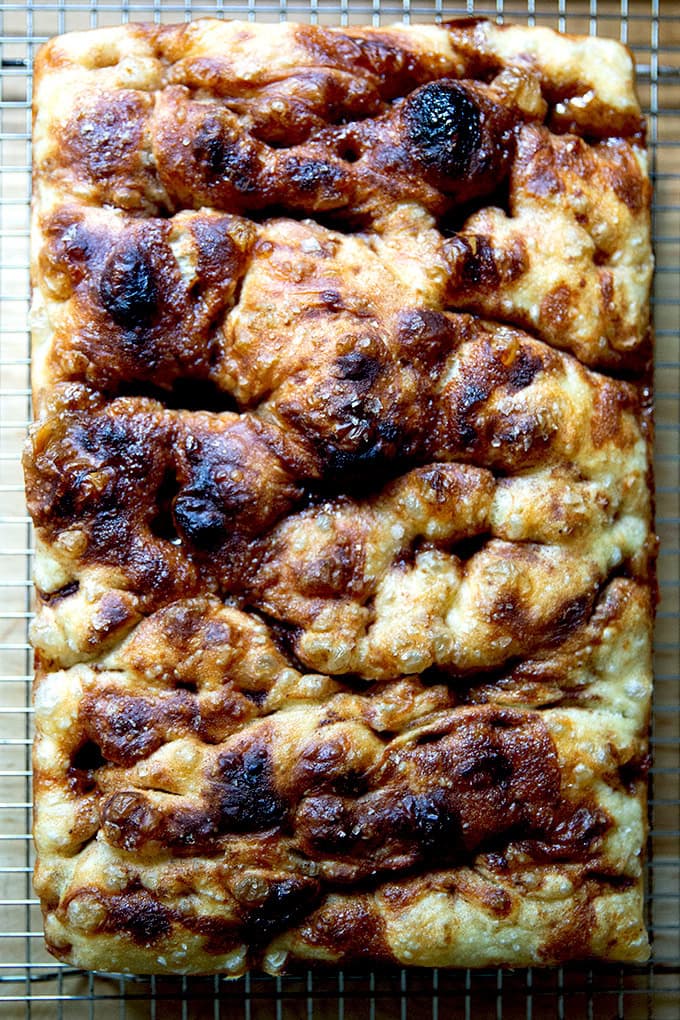 Just-baked cinnamon-sugar focaccia on a cooling rack. - 36