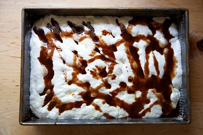 Focaccia dough topped with cinnamon-sugar butter mixture. - 30