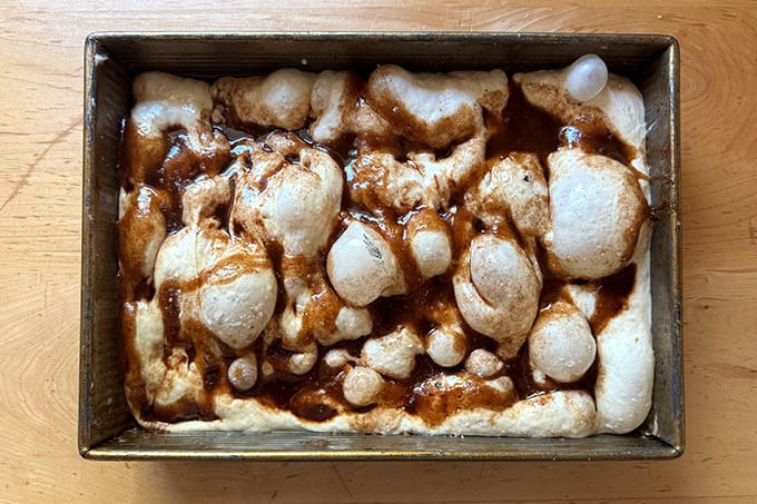 A dimpled cinnamon sugar focaccia ready for the oven.  - 43