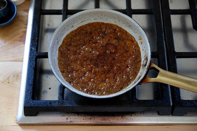 A small skillet filled with pomegranate butter.
