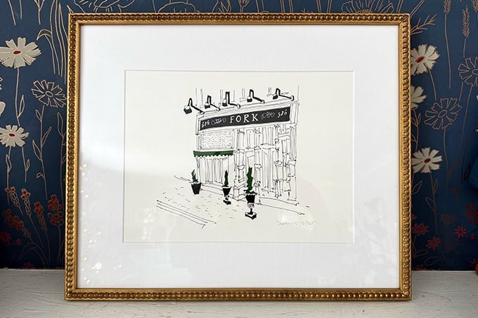 A framed picture of a sketch of Fork restaurant.