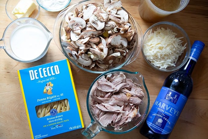 The ingredients to make turkey tetrazzini on a countertop. - 39
