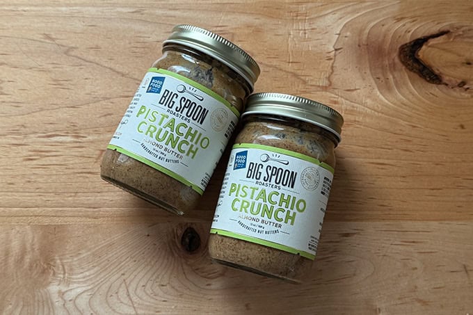 Two jars of Big Spoon Pistachio Crunch.