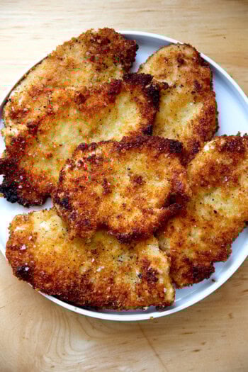 Just-cooked chicken cutlets on a plate.