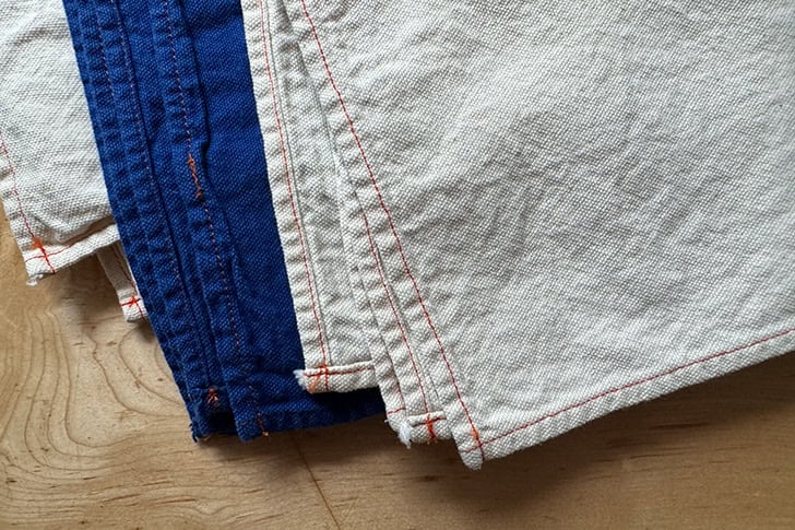 An up-close shot of the hem of a set of four cloth napkins made by Utility Canvas.