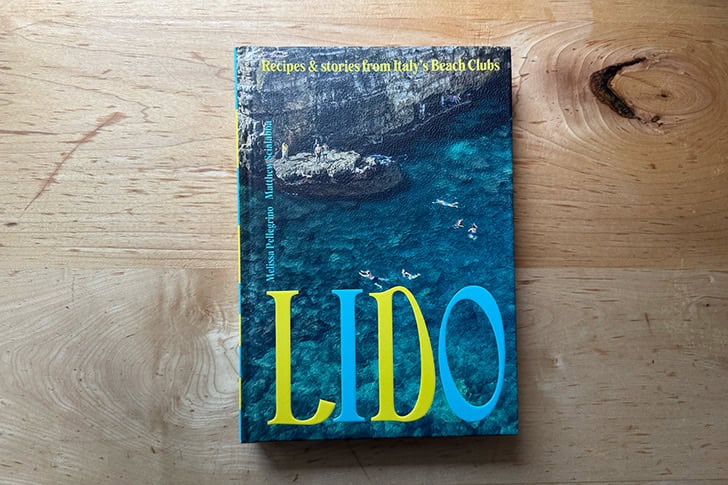 Lido, a cookbook by Melissa Pellegrino, on a countertop.
