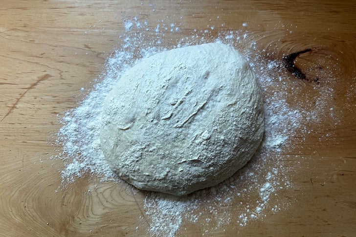 The dough to make Overnight Sandwich Rolls turned out onto a floured work surface.