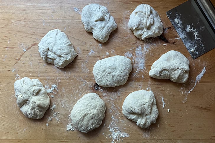 The dough for overnight sandwich rolls divided into 8 equally weighted portions.
