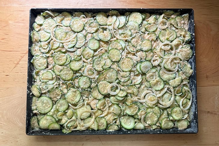 An unbaked sheet pan of Scarpaccia.