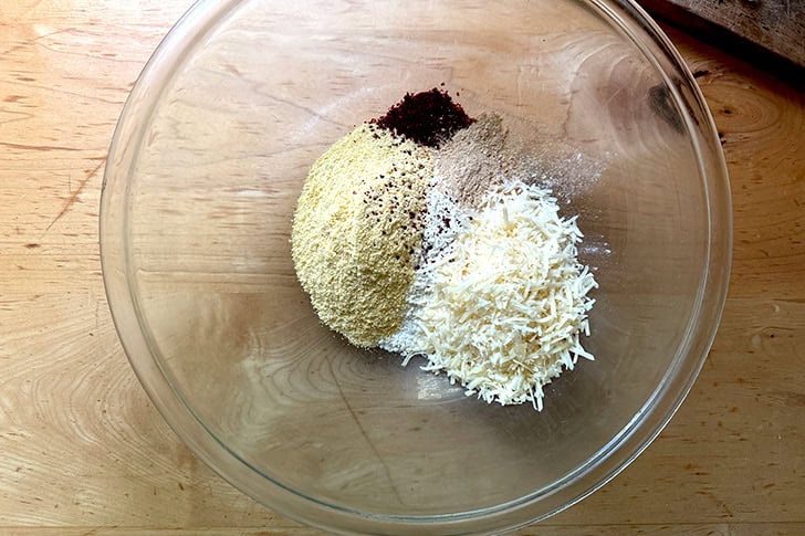 The dry ingredients to make Scarpaccia in a large glass bowl.
